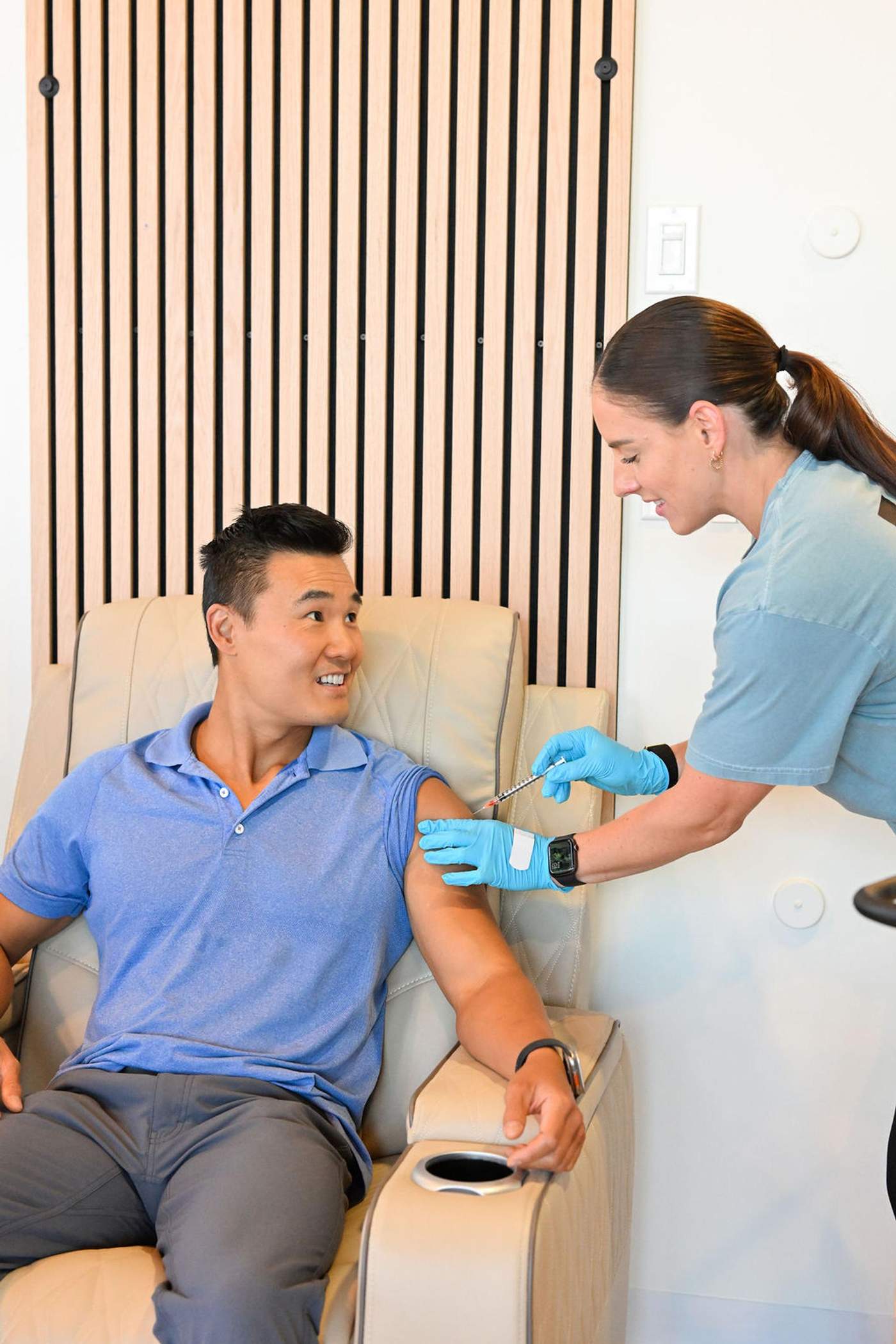 A registered nurse giving a client a wellness injection at Vivolo Wellness Club in Charlestown, MA